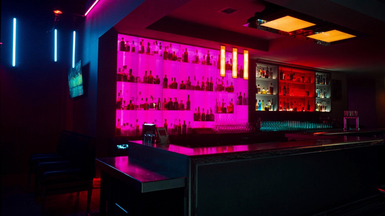 Bar counter with illuminated bottles