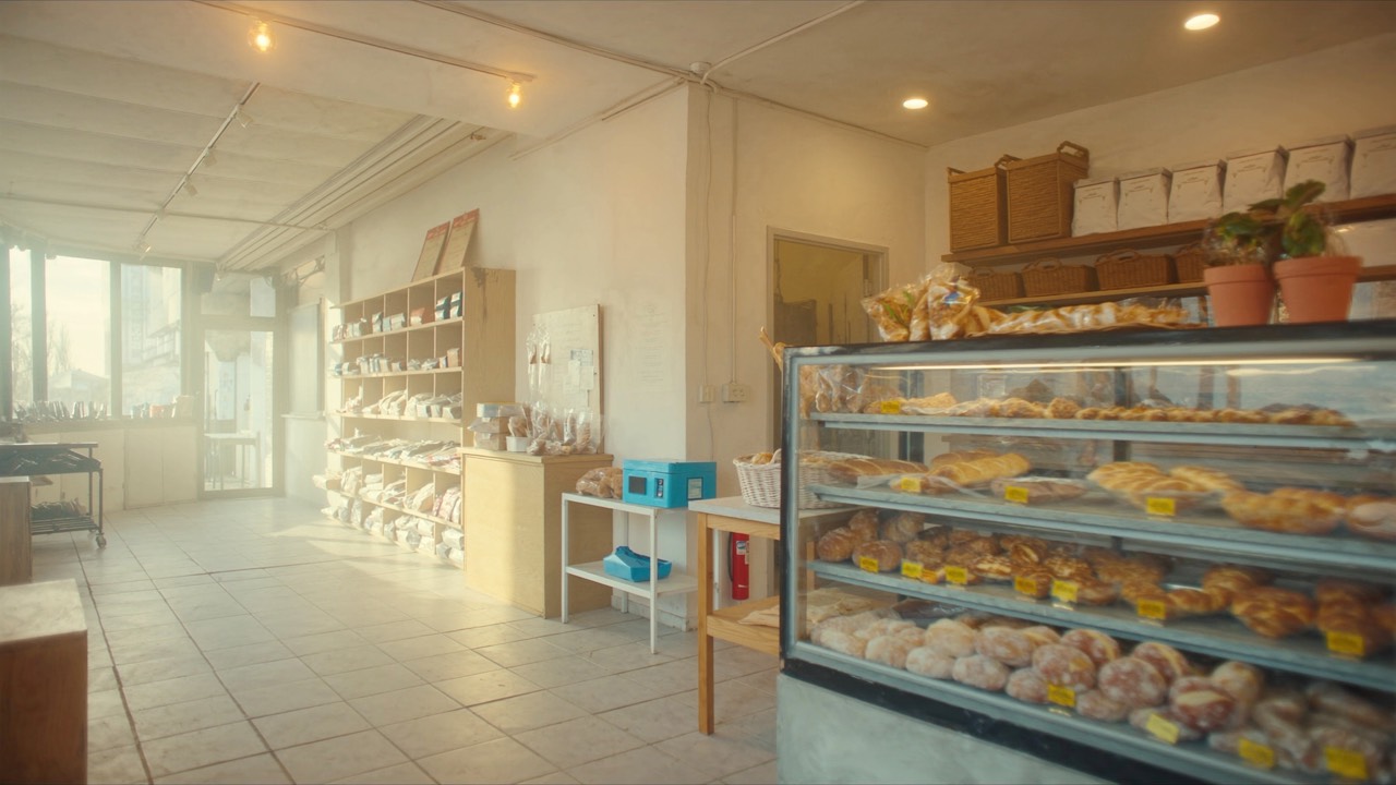 Bakery display case with freshly baked bread and pastries
